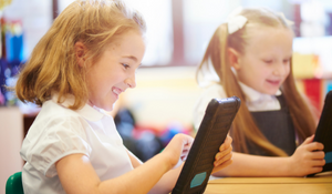 Young students using technology to enhance their learning experience