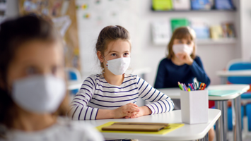 Students using masks while in class during the pandemic