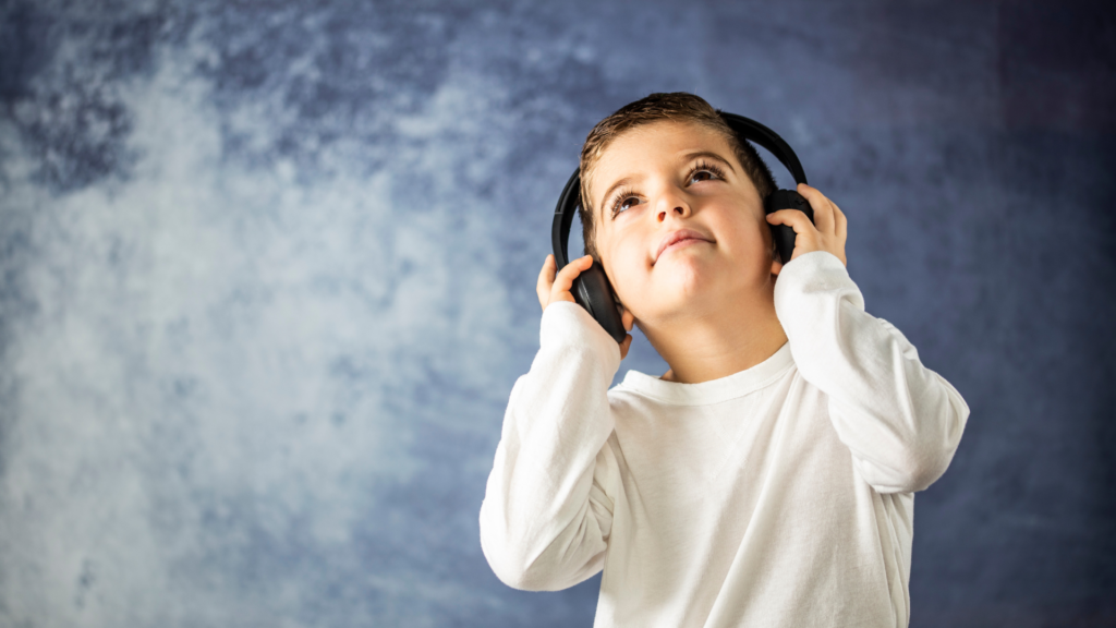 k-12 child listening through headphones